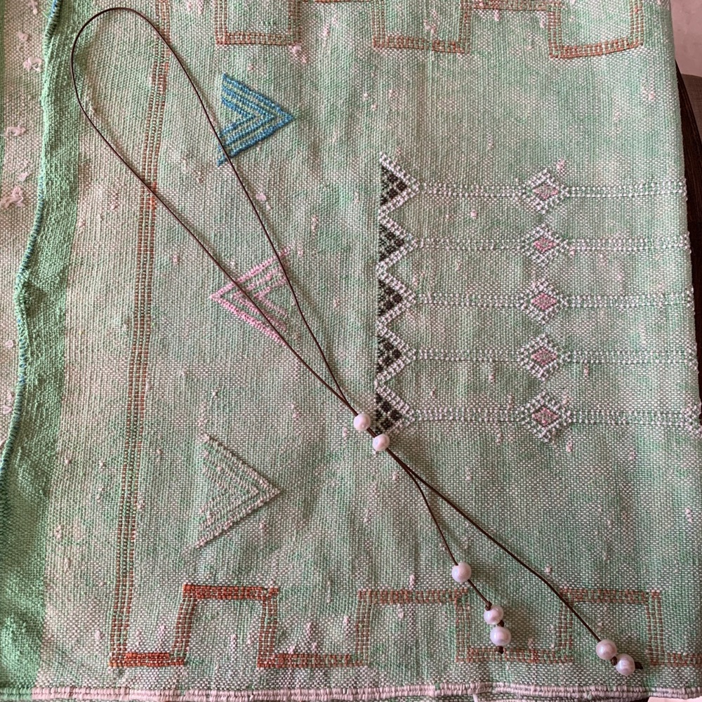 Pearls on cord necklace